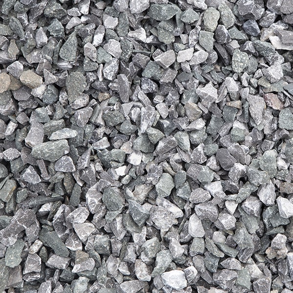 using different sizes and colors of walkway gravel, along with creative patterns, can add visual interest to any landscape design